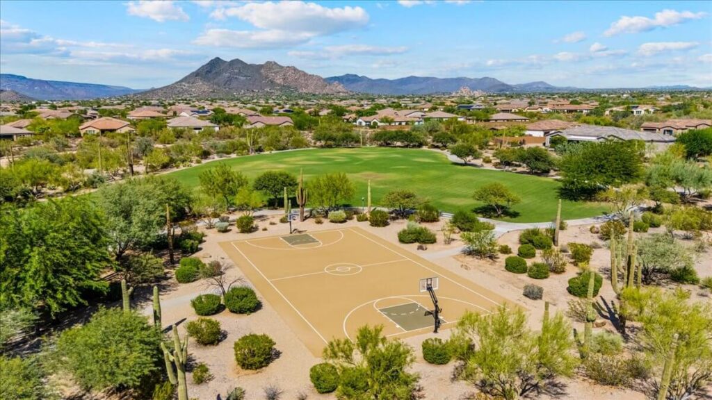 Basketball court and large green park space in Lone Mountain community, Cave Creek AZ with mountain views