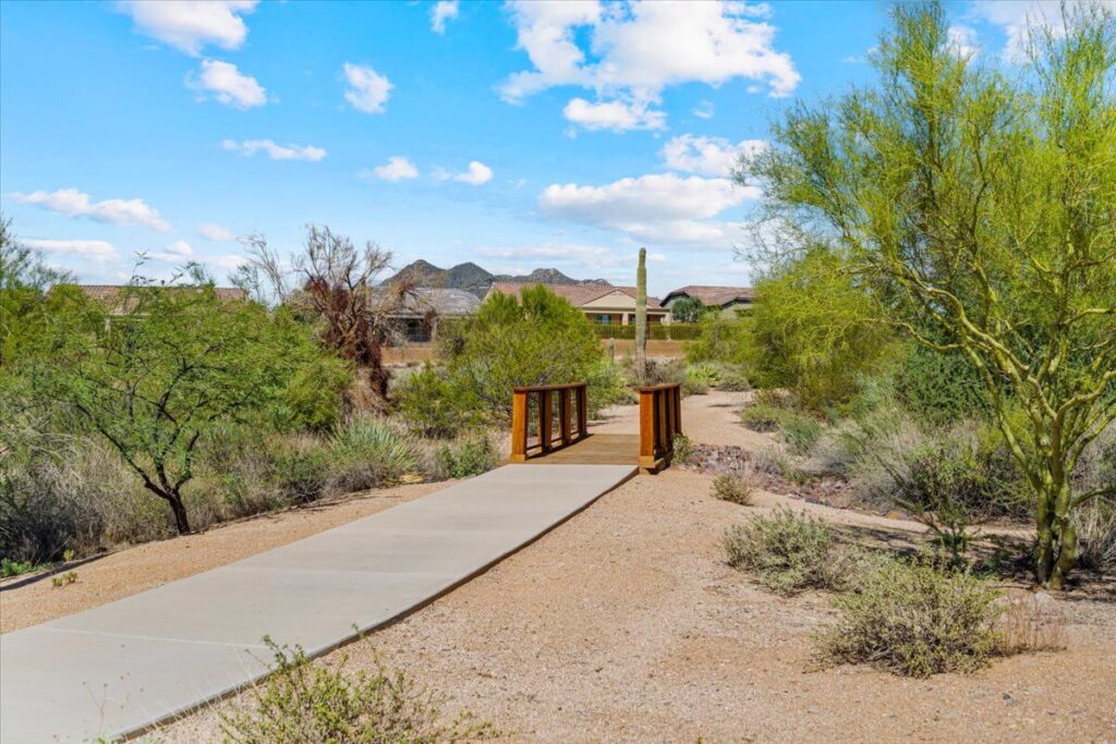 Trail with wooden bridge through desert landscape in Lone Mountain community Cave Creek AZ